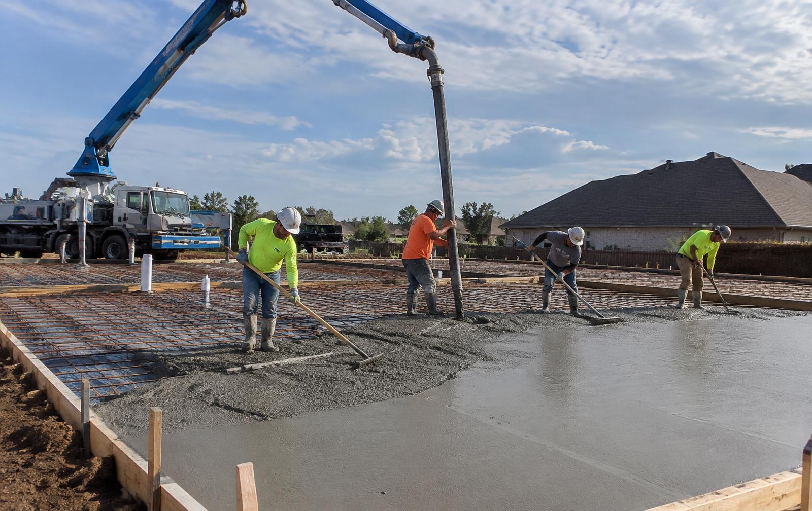 Representative crew placing a concrete slab foundation