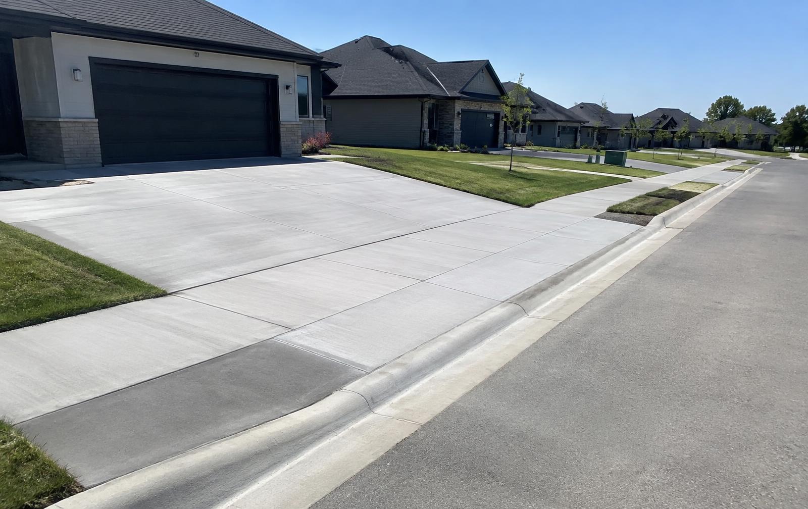 Finished driveway and sidewalk at a new home